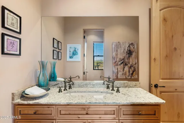 a view of bathroom with dual sinks