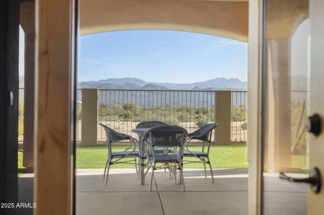 a view of a balcony with furniture