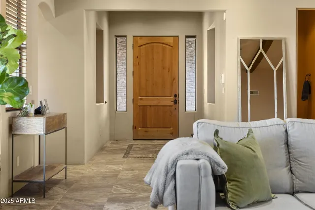 a bedroom with a bed and a mirror