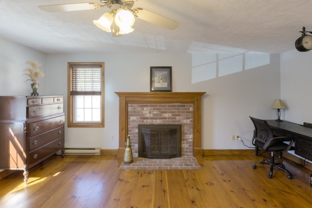 51 Webber Road Brookfield, MA 01506 - Photo 17 of 42 a living room with furniture and a fireplace