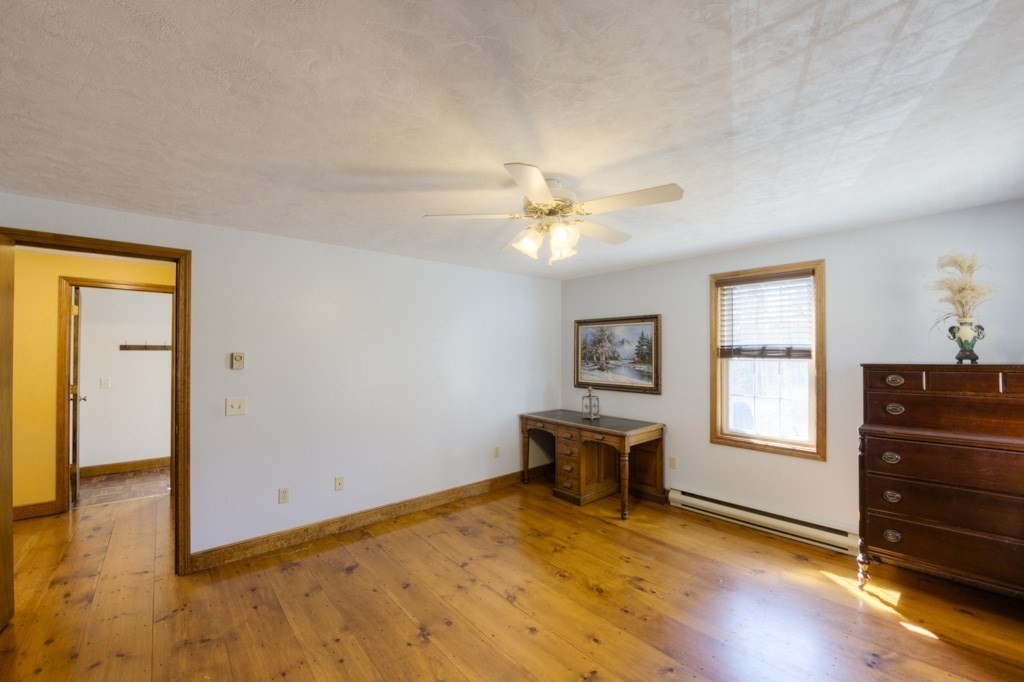 51 Webber Road Brookfield, MA 01506 - Photo 20 of 42 a view of an empty room with window and wooden floor