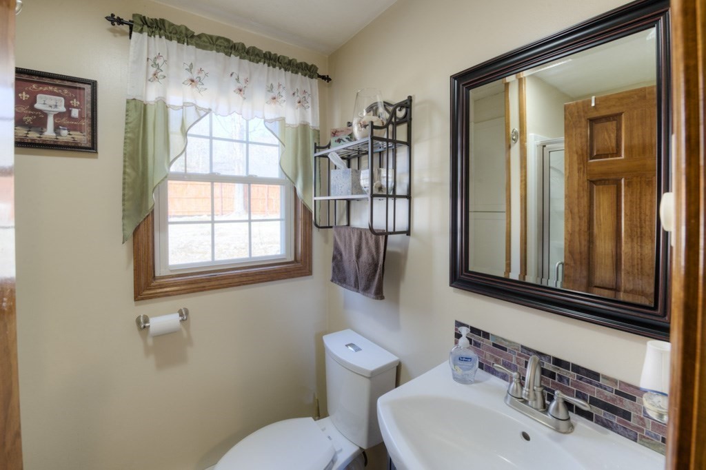 51 Webber Road Brookfield, MA 01506 - Photo 23 of 42 a bathroom with a sink a toilet and a mirror