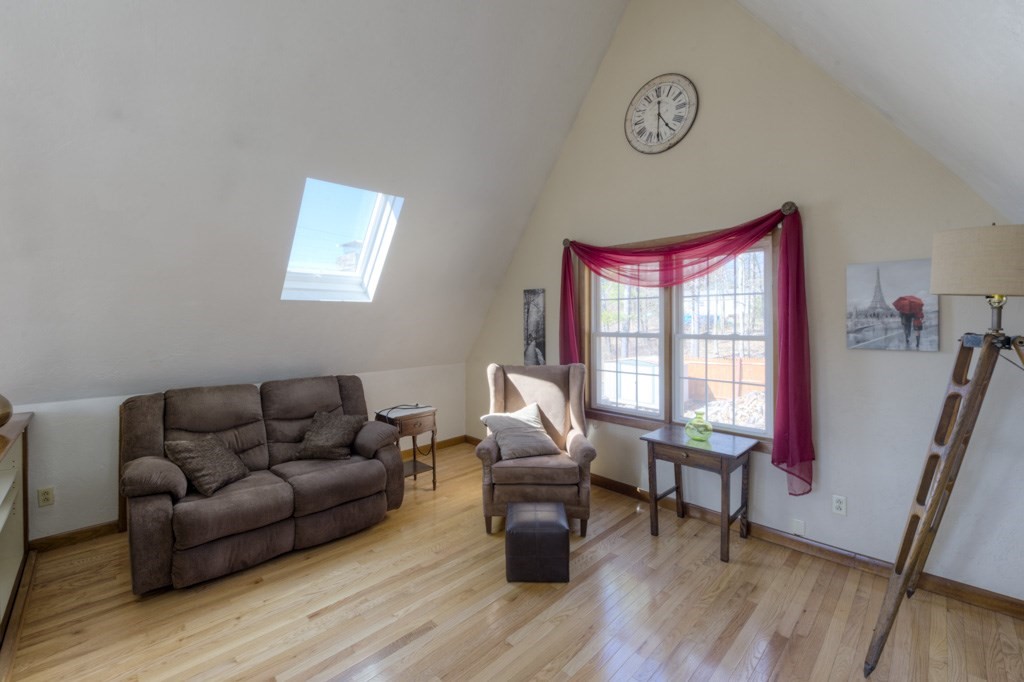 51 Webber Road Brookfield, MA 01506 - Photo 24 of 42 a living room with furniture and a wooden floor
