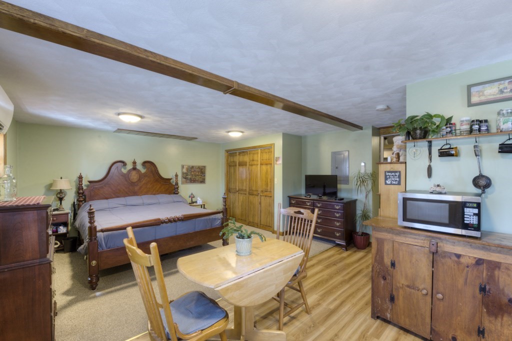 51 Webber Road Brookfield, MA 01506 - Photo 30 of 42 a living room with furniture and a flat screen tv