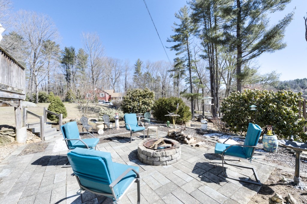51 Webber Road Brookfield, MA 01506 - Photo 3 of 42 a view of a dinning table and chairs in the patio