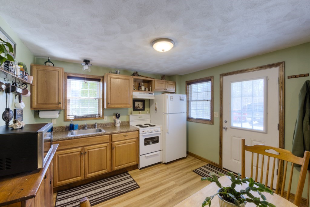 51 Webber Road Brookfield, MA 01506 - Photo 32 of 42 a kitchen that has a sink and cabinets