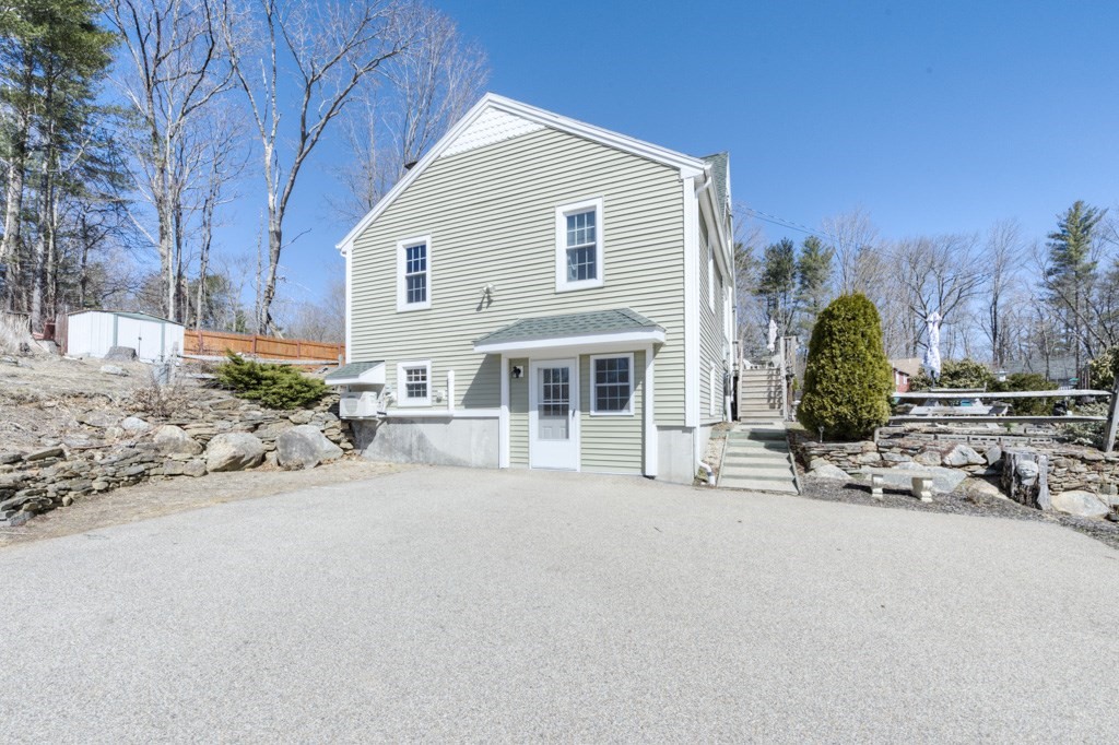 51 Webber Road Brookfield, MA 01506 - Photo 41 of 42 a view of a house with a patio