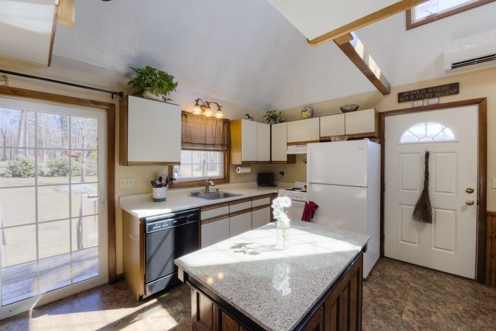 51 Webber Road Brookfield, MA 01506 - Photo 5 of 42 a kitchen with stainless steel appliances a stove refrigerator sink and cabinets