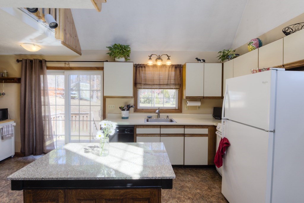 51 Webber Road Brookfield, MA 01506 - Photo 7 of 42 a kitchen with kitchen island a sink a stove a refrigerator and cabinets