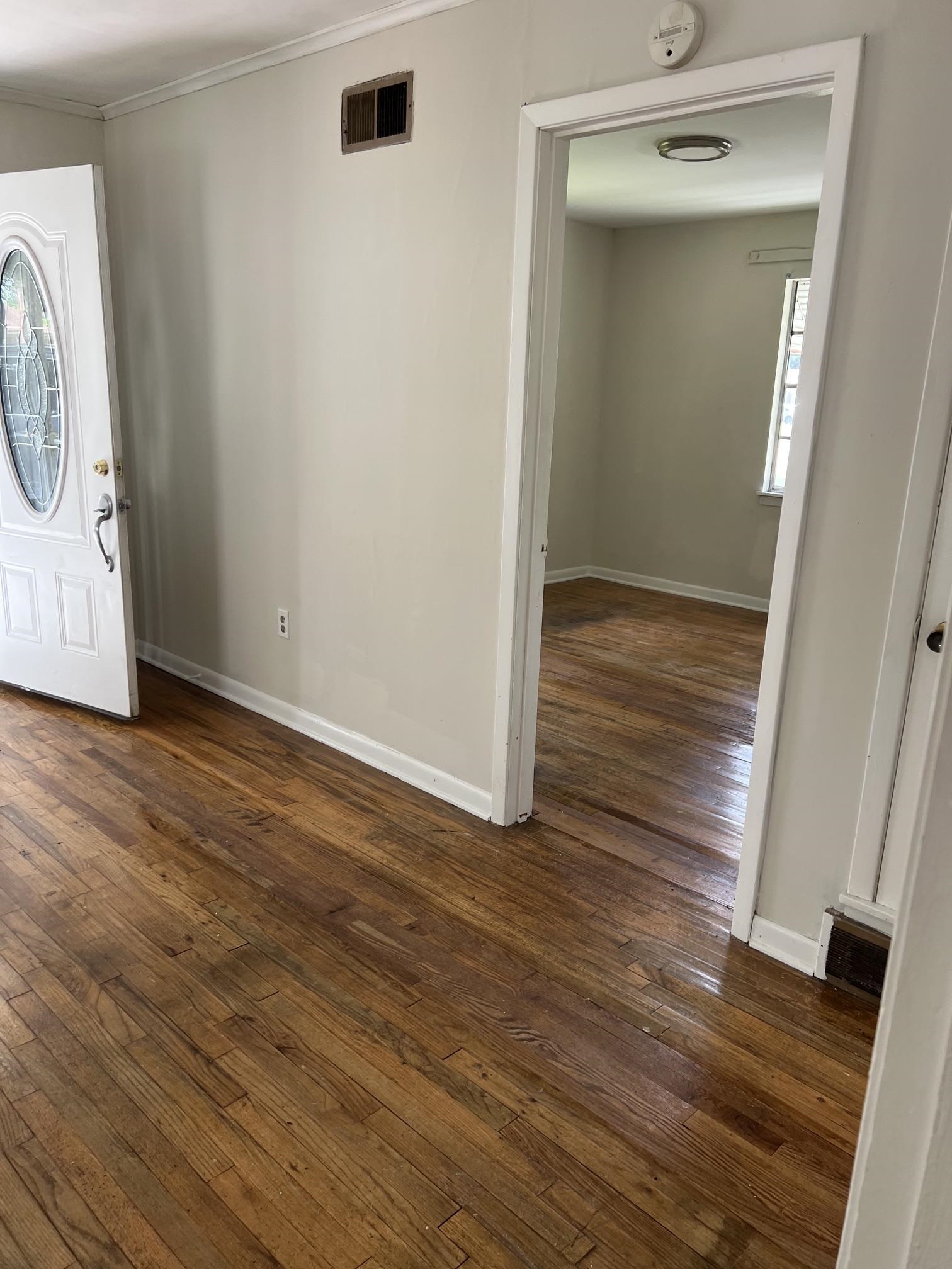 518 Harris Street Collierville, TN 38017 - Photo 4 of 13 Hardwood flooring extends throughout the space, complemented by neutral wall tones and white trim