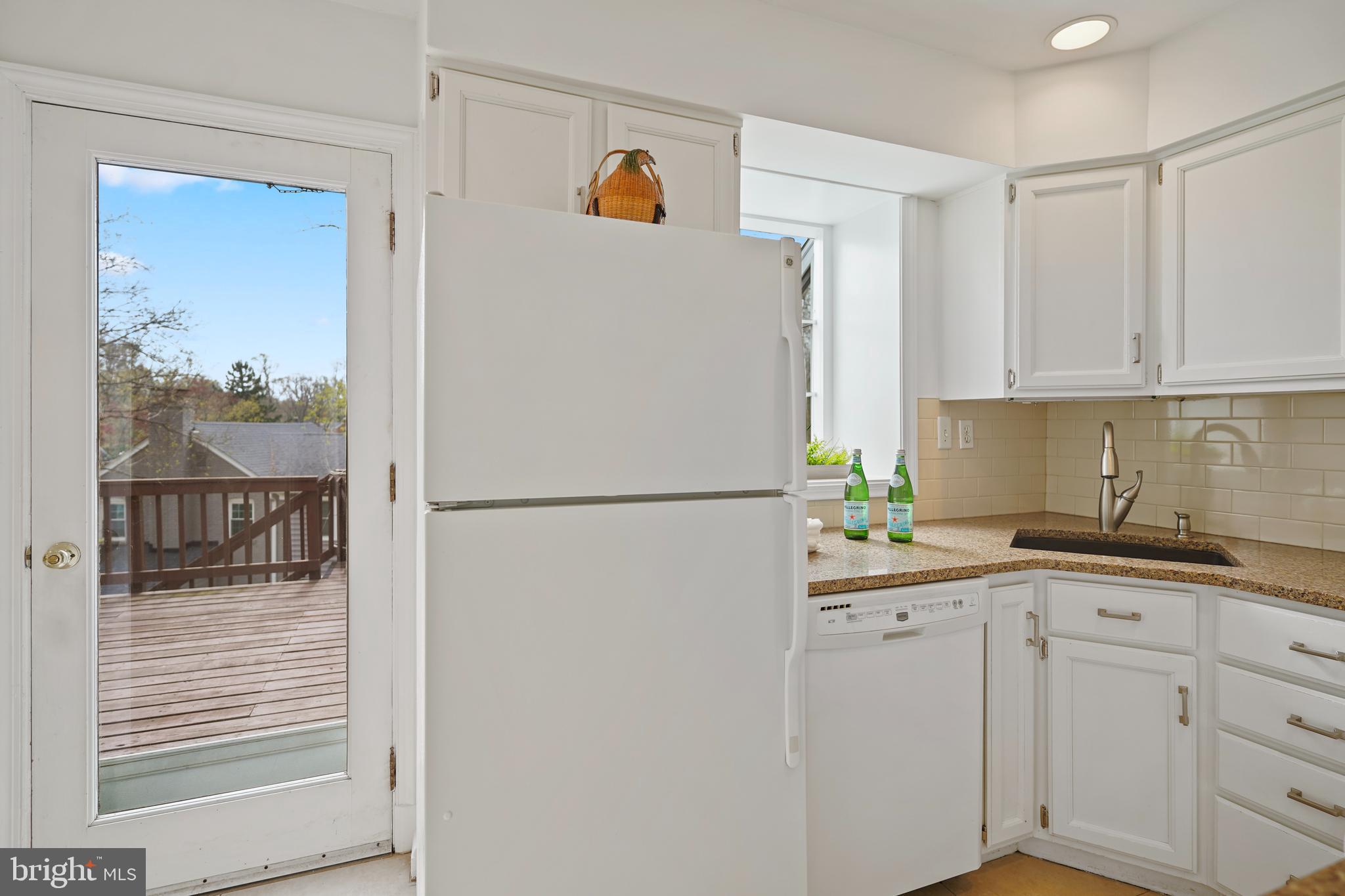 322 Penwood Road Silver Spring, MD 20901 - Photo 4 of 23 Bright kitchen that overlooks the deck and yard.