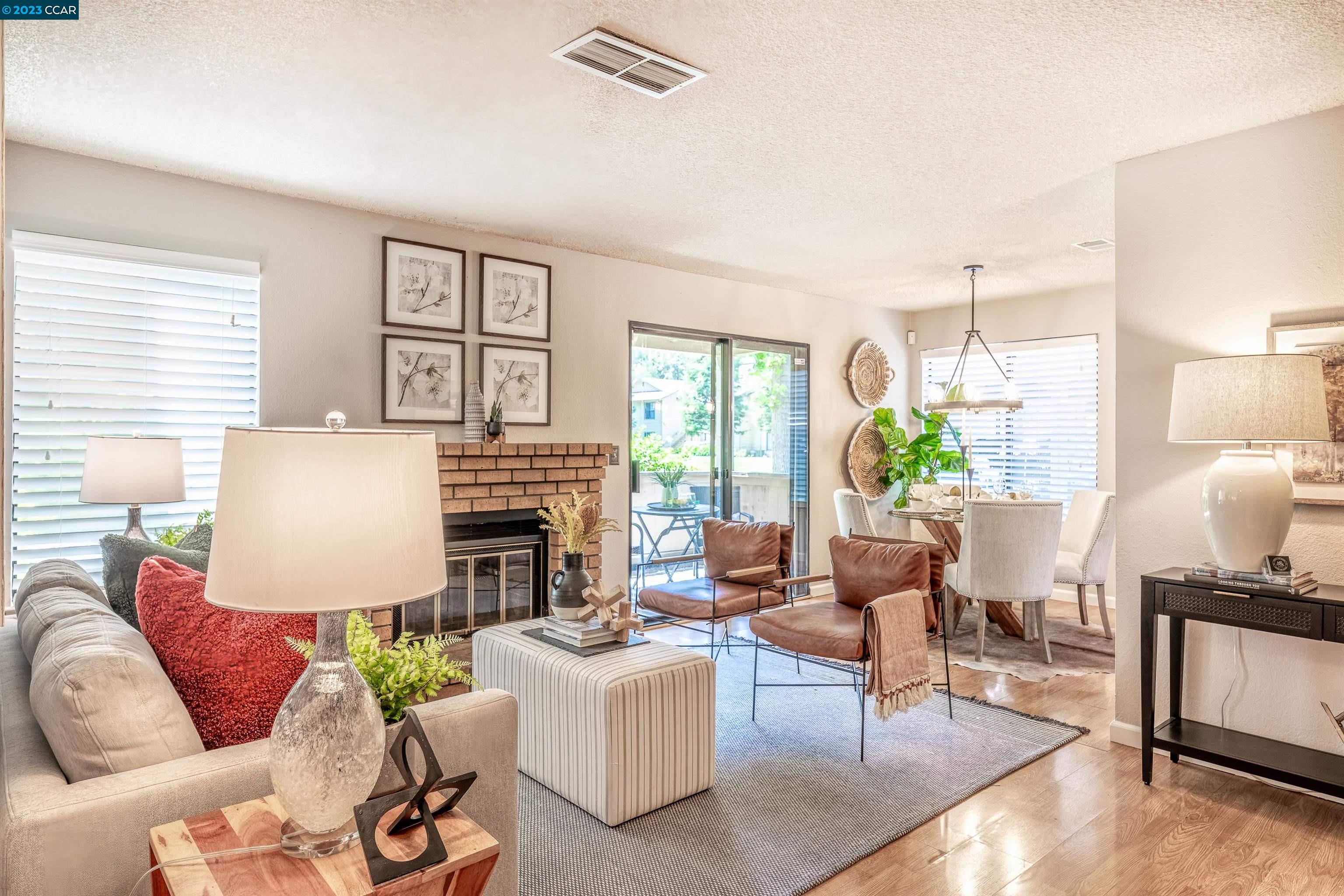 509 Bristol Hercules, CA 94547 - Photo 1 of 1 a living room with furniture fireplace and a window