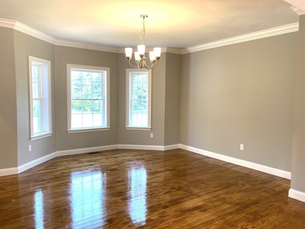2 Littlefield Road Acton, MA 01720 - Photo 9 of 19 a view of empty room with wooden floor and fan