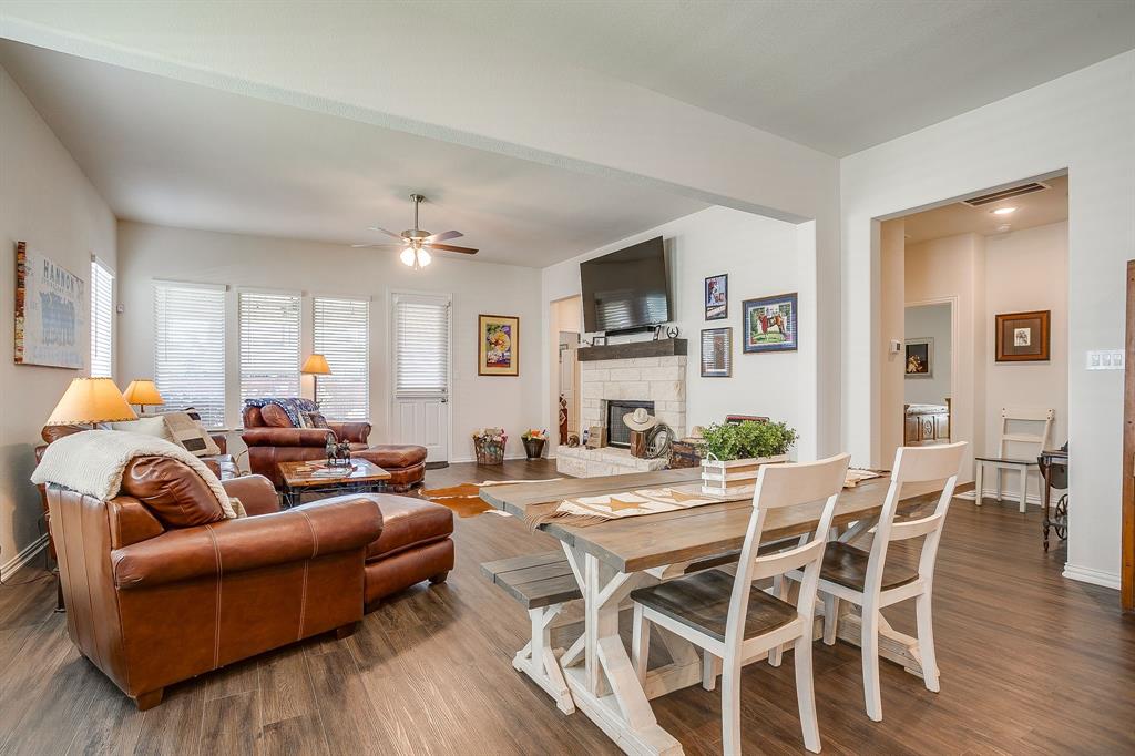 1328 San Marcus Drive Springtown, TX 76082 - Photo 12 of 37 a living room with furniture a fireplace and a flat screen tv