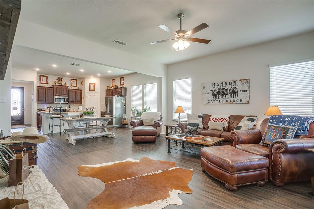 1328 San Marcus Drive Springtown, TX 76082 - Photo 16 of 37 a living room with furniture kitchen view and a large window