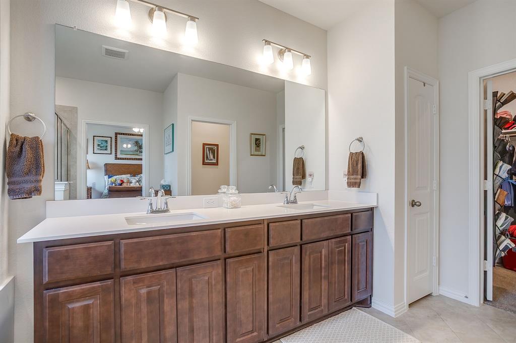 1328 San Marcus Drive Springtown, TX 76082 - Photo 22 of 37 a bathroom with a double vanity sink and a mirror