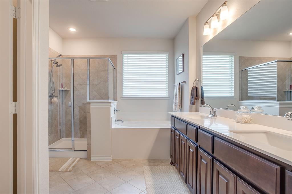 1328 San Marcus Drive Springtown, TX 76082 - Photo 24 of 37 Bathroom with a garden tub, light tile patterned floors, a shower stall, double vanity, and plenty of natural light