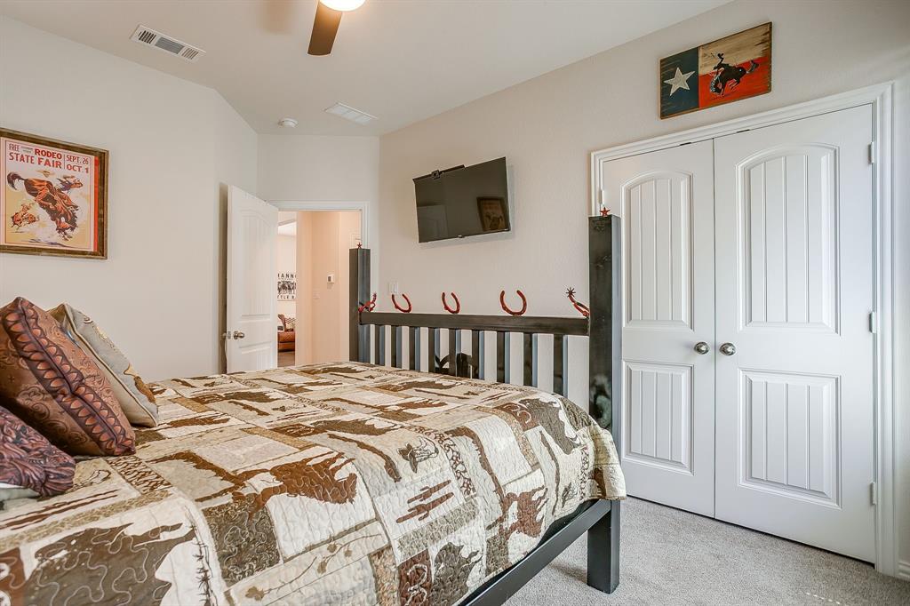 1328 San Marcus Drive Springtown, TX 76082 - Photo 28 of 37 a bed sitting in a bedroom and a flat screen tv