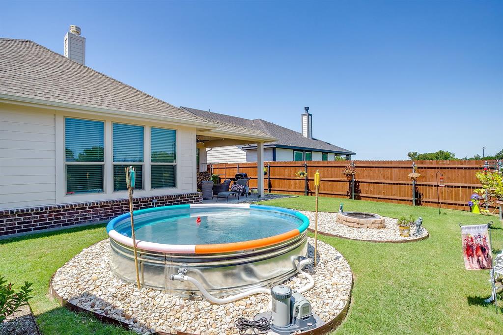 1328 San Marcus Drive Springtown, TX 76082 - Photo 37 of 37 View of swimming pool featuring a patio area and a fire pit