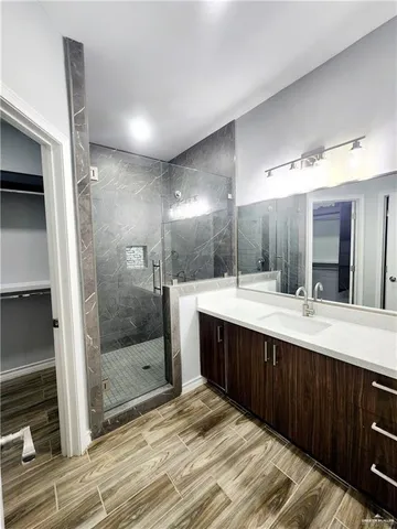 a bathroom with a sink and mirror