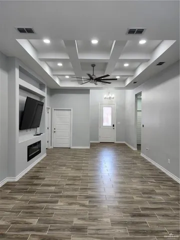 a view of a livingroom with an empty room and a flat screen tv