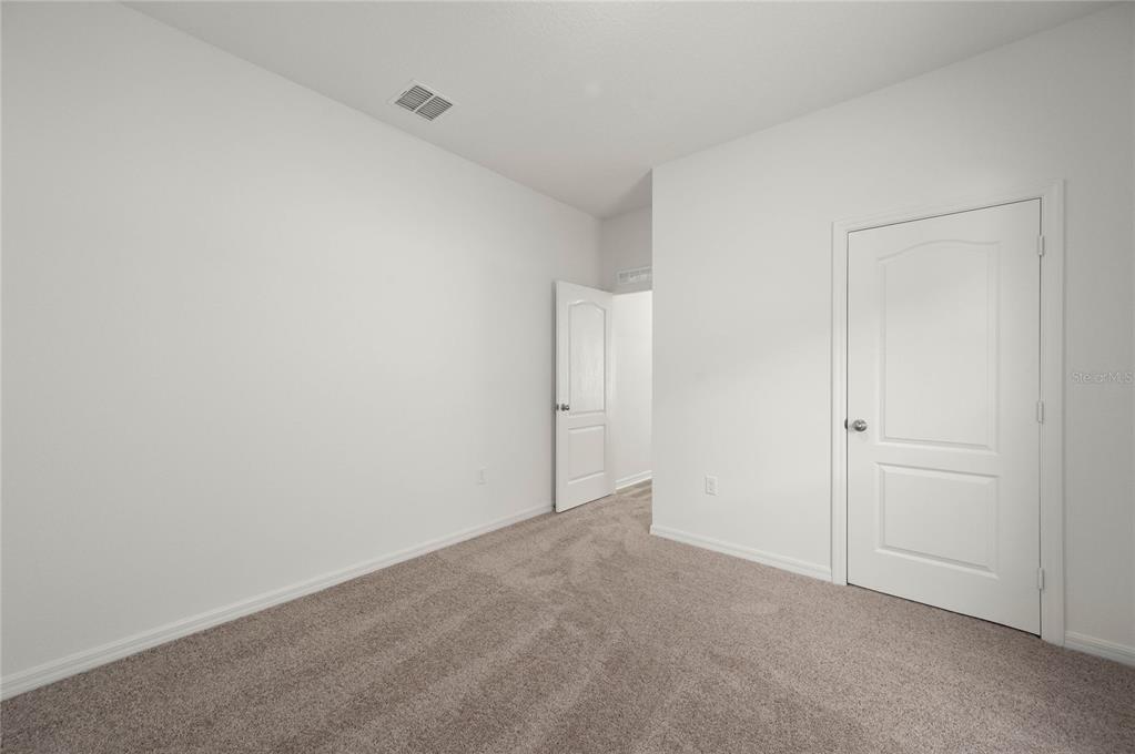 13284 Tula Loop Astatula, FL 34705 - Photo 15 of 24 a view of an empty room