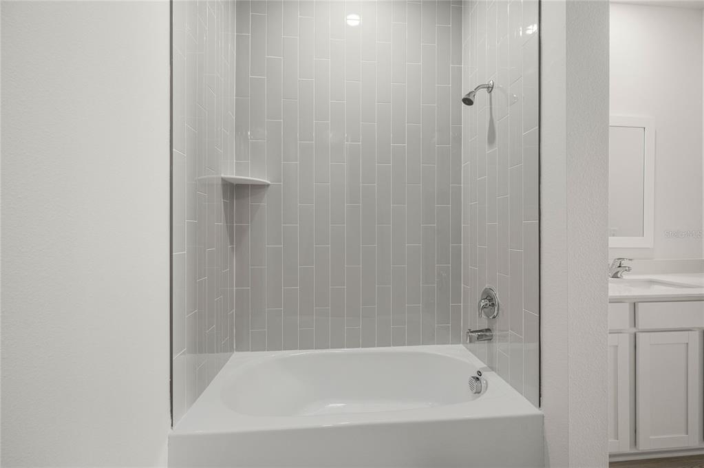 13284 Tula Loop Astatula, FL 34705 - Photo 22 of 24 a bathroom with a bathtub