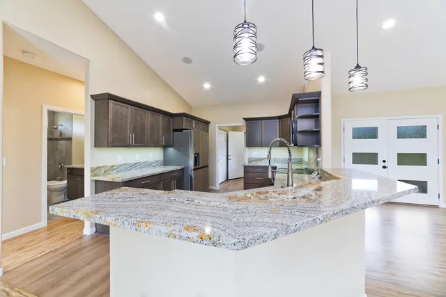 a view of empty room with wooden floor and closet