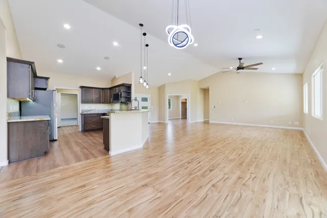 a view of kitchen with cabinets and wooden floor