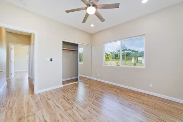 a kitchen with a wooden floor and window
