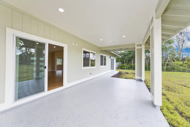 a view of an entryway with wooden floor and garden