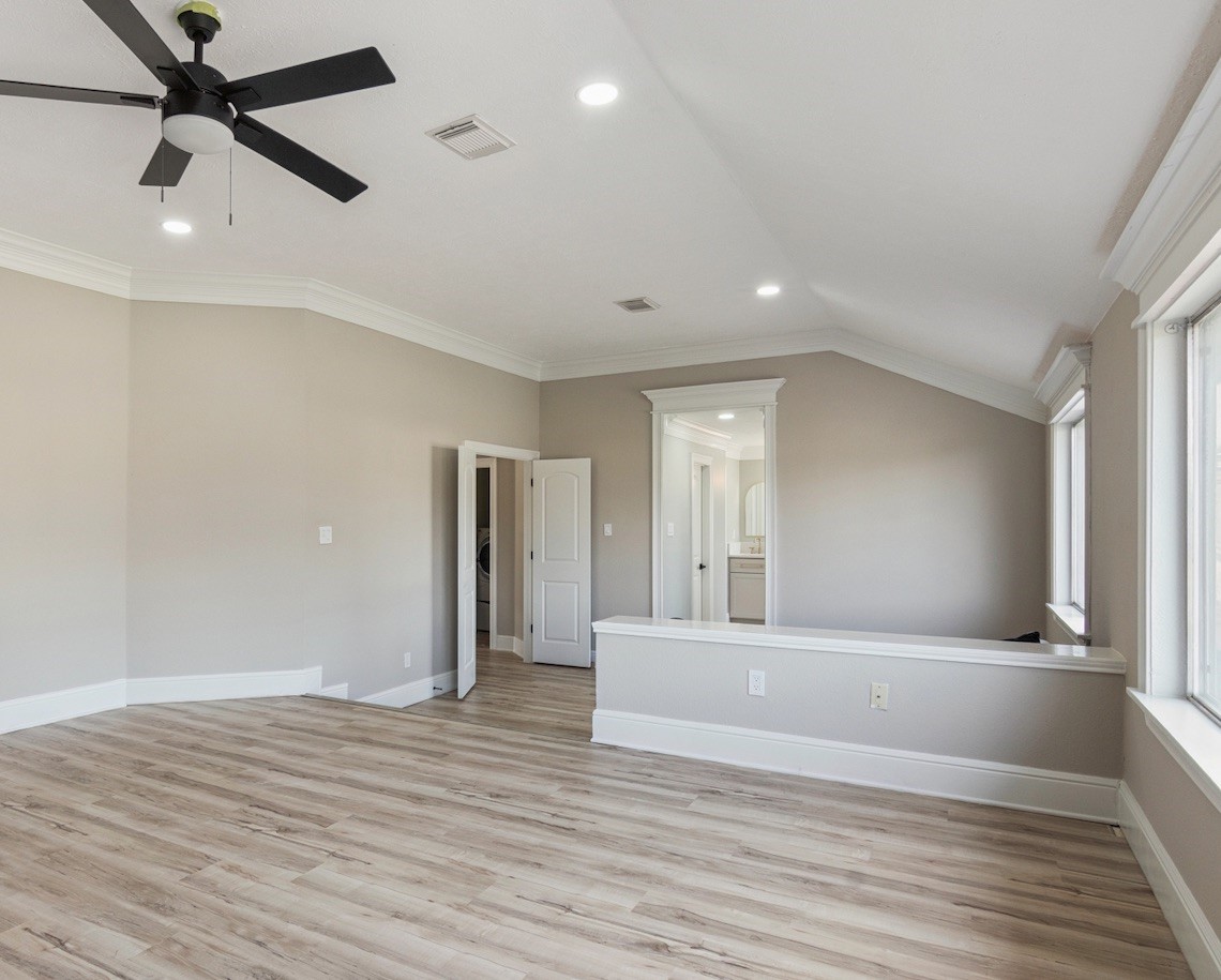 13123 Labelle Lane Houston, TX 77015 - Photo 14 of 23 a view of a livingroom with wooden floor and a ceiling fan