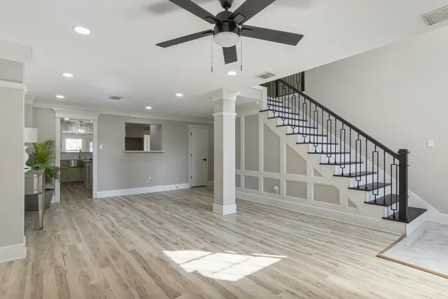 a view of entryway and hall with wooden floor