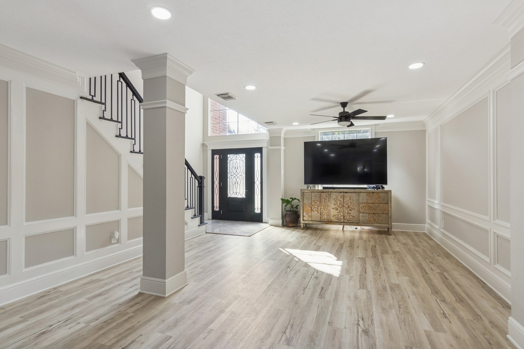 13123 Labelle Lane Houston, TX 77015 - Photo 4 of 23 a view of a livingroom with wooden floor and stairs
