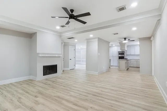 a view of a kitchen with a sink and a kitchen counter top