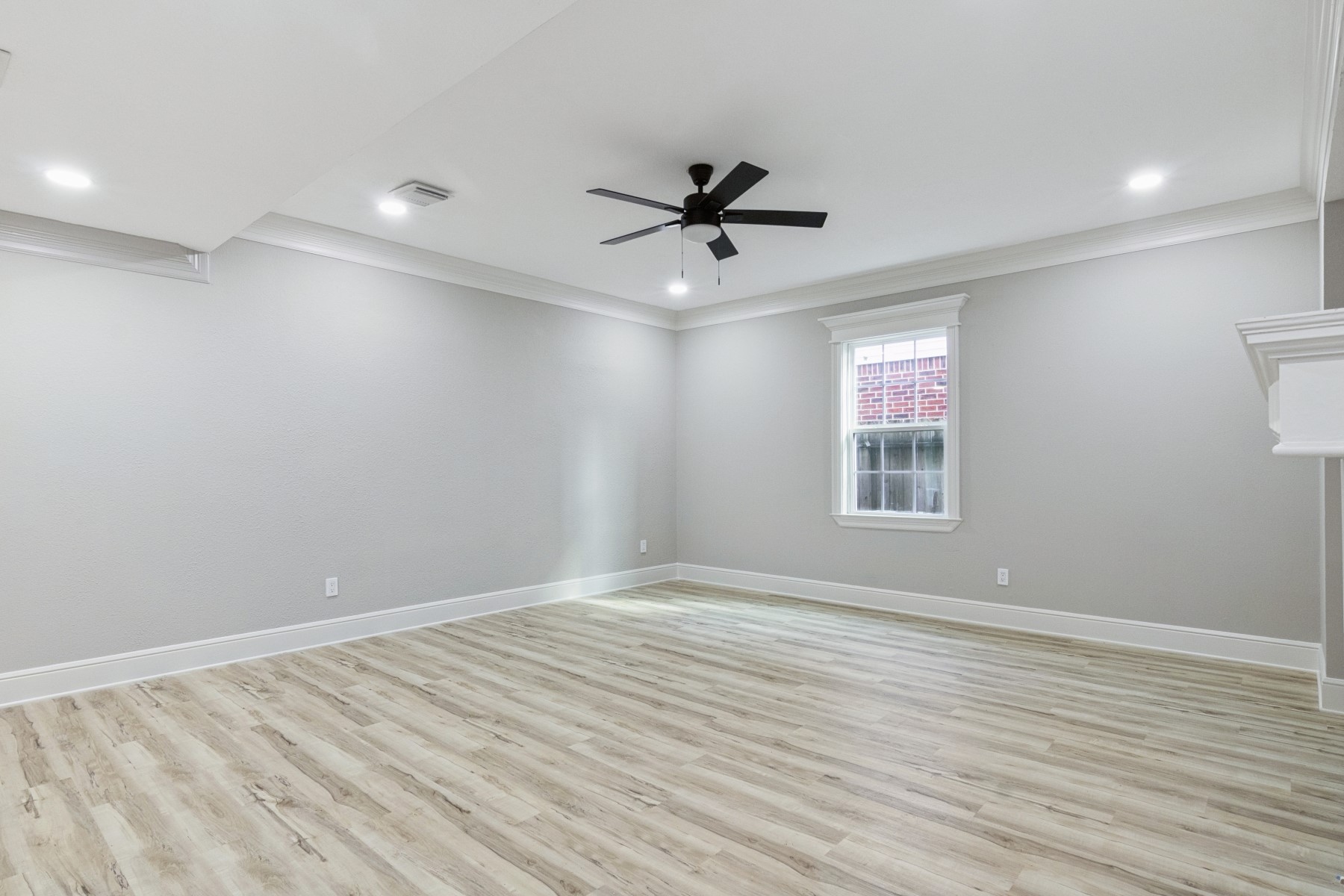 13123 Labelle Lane Houston, TX 77015 - Photo 7 of 23 a view of empty room with wooden floor and fan