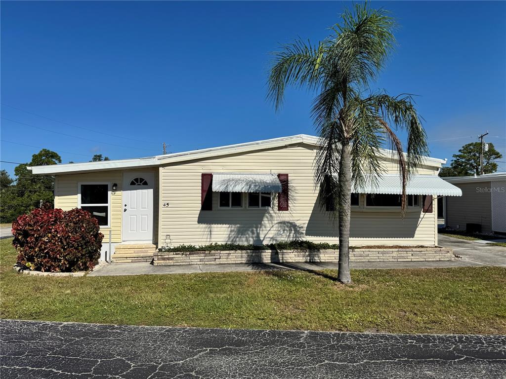 a view of a house with a yard