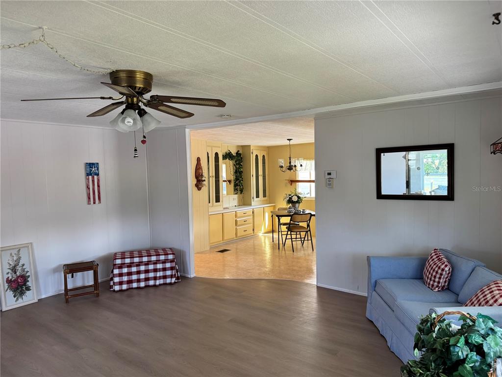 1891 Englewood Road, Unit 45 Englewood, FL 34223 - Photo 12 of 55 a living room with furniture and a table