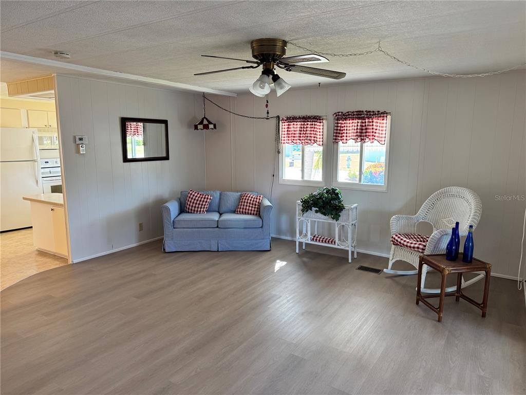 1891 Englewood Road, Unit 45 Englewood, FL 34223 - Photo 13 of 55 a living room with furniture and a window