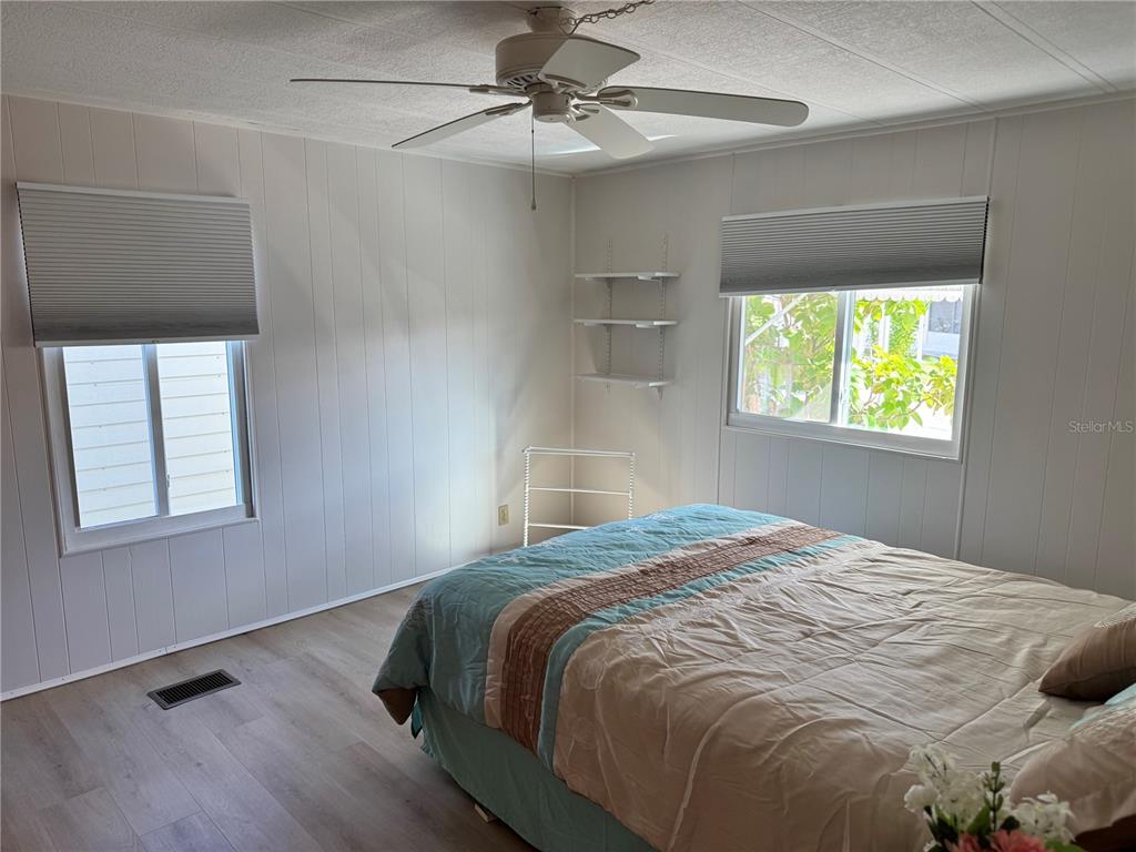 1891 Englewood Road, Unit 45 Englewood, FL 34223 - Photo 18 of 55 a bedroom with a bed and a window