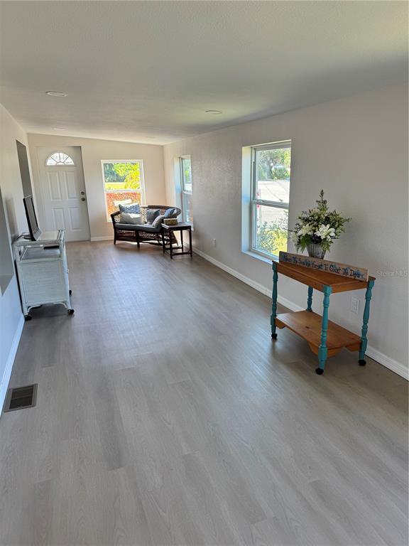 1891 Englewood Road, Unit 45 Englewood, FL 34223 - Photo 26 of 55 a living room with furniture and a window