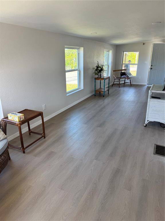 1891 Englewood Road, Unit 45 Englewood, FL 34223 - Photo 27 of 55 a living room with furniture and a window