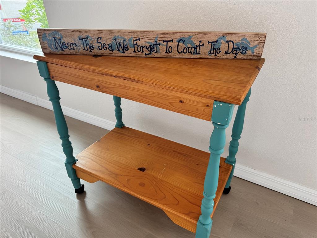 1891 Englewood Road, Unit 45 Englewood, FL 34223 - Photo 30 of 55 a view of a room with rack on the wall