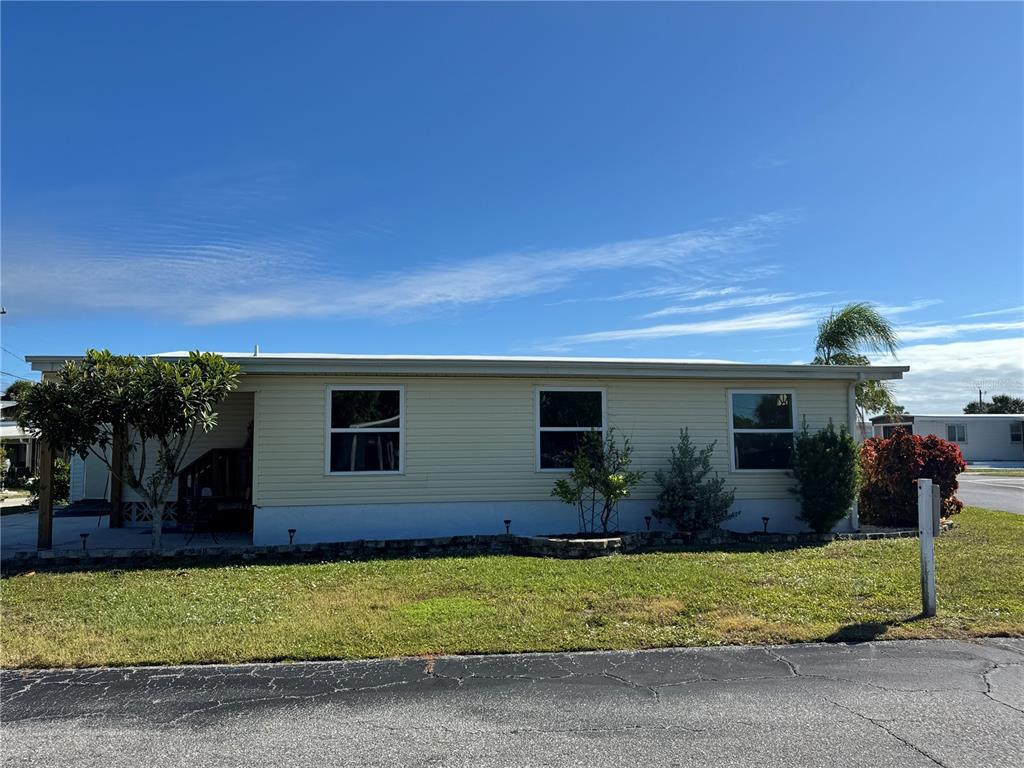 1891 Englewood Road, Unit 45 Englewood, FL 34223 - Photo 35 of 55 a house view with a garden space
