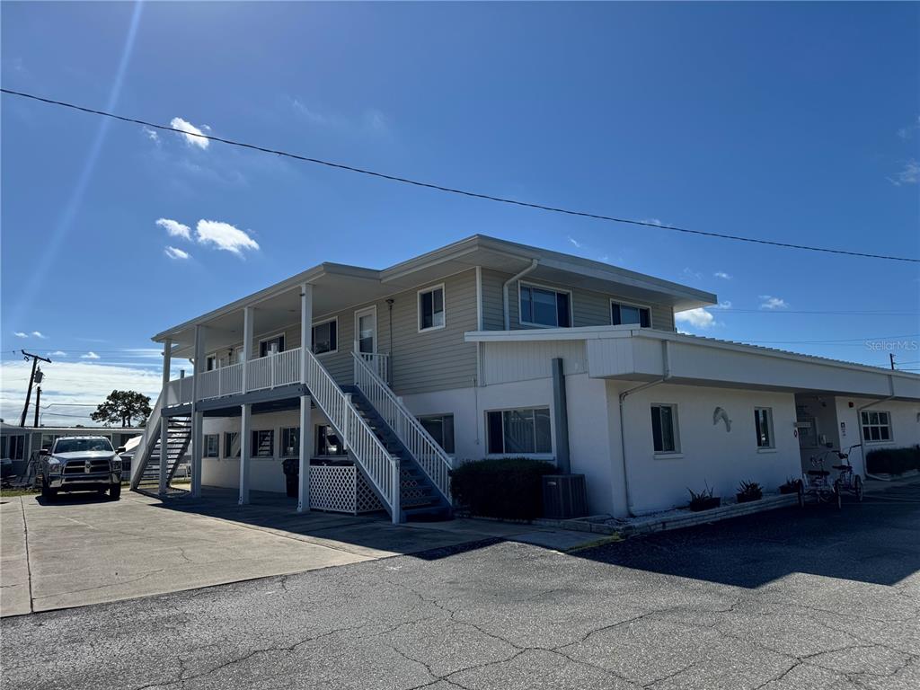 1891 Englewood Road, Unit 45 Englewood, FL 34223 - Photo 44 of 55 a view of a house with a patio