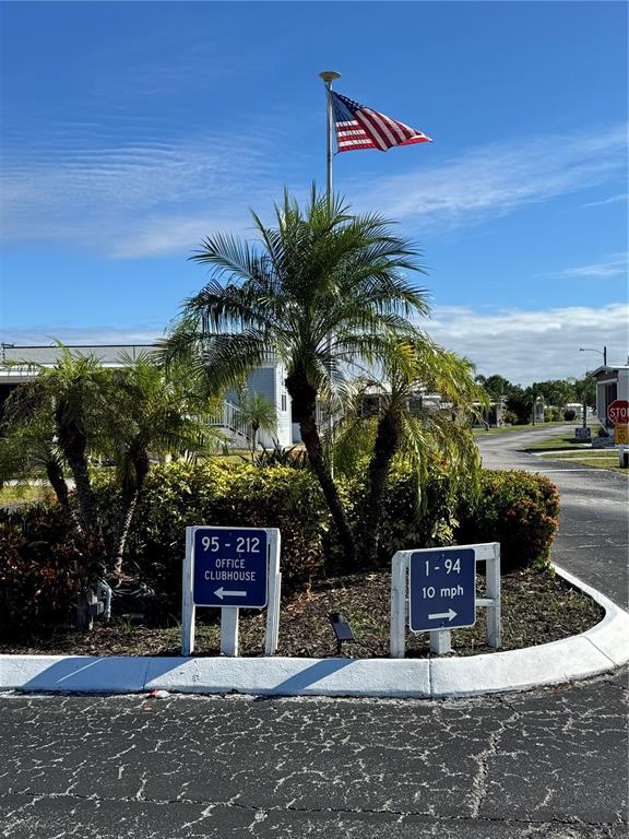 1891 Englewood Road, Unit 45 Englewood, FL 34223 - Photo 47 of 55 a sign that is on the side of a road