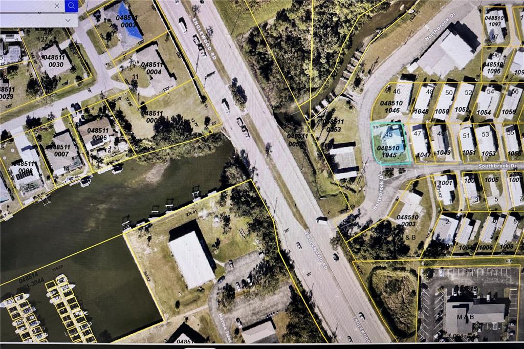 1891 Englewood Road, Unit 45 Englewood, FL 34223 - Photo 48 of 55 an aerial view of multiple houses