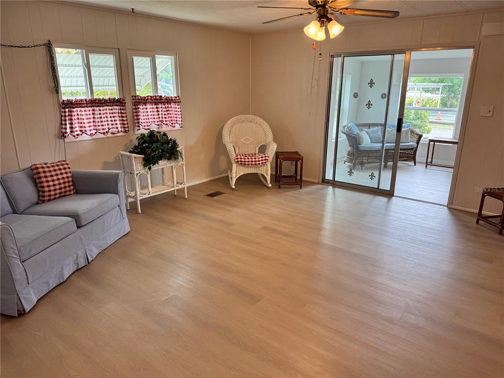 1891 Englewood Road, Unit 45 Englewood, FL 34223 - Photo 51 of 55 a living room with furniture and a window