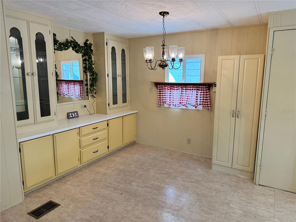 1891 Englewood Road, Unit 45 Englewood, FL 34223 - Photo 8 of 55 a spacious bathroom with double vanity and a mirror