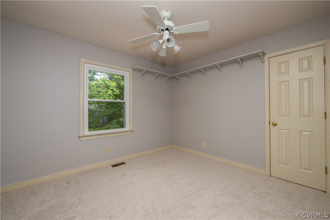 5001 Cedar Cliff Road Chester, VA 23831 - Photo 14 of 29 The third bedroom looks out over the rear yard and